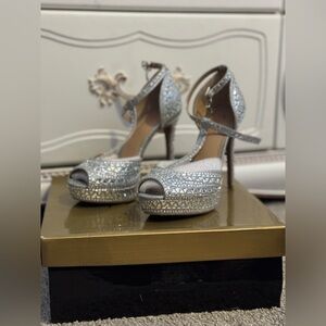 Thalia Sodi silver high heels